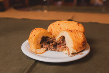 Cassava bomb stuffed with meat served on a plate.