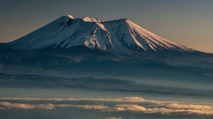 Snow blankets the volcanic peak of Mount Fuji in a serene winter landscape against the sky