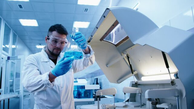 A scientist works with high-tech equipment in a modern laboratory, analyzing biological material and conducting experiments. Concept research of biological samples using cutting-edge technology.