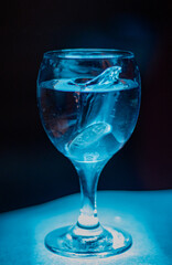 glass of water on blue background
