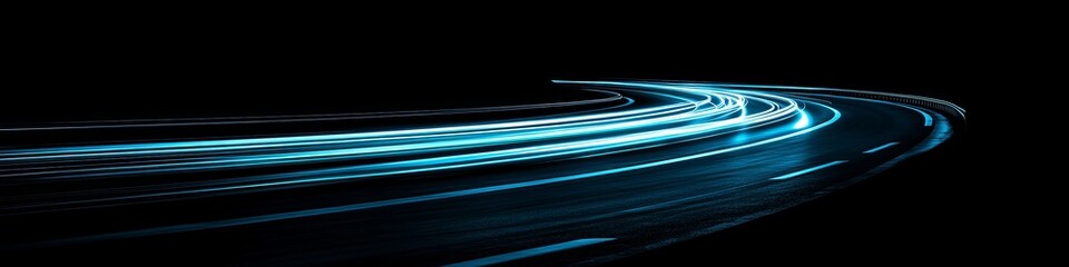 Fototapeta premium Abstract Blue Light Trails, Long Exposure of Car Headlights on a Winding Road at Night