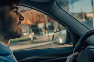novice or young driver driving in the car