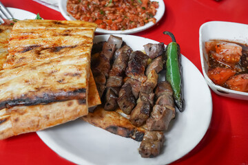 liver kebap with garni on the table