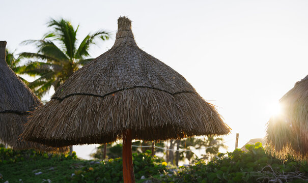 Idyllic Sunset with Thatched Roofs in Tulum, Mexico