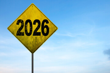 Obraz premium An image with a signpost pointing 2026. One direction points to 2027, the other points to 2026.