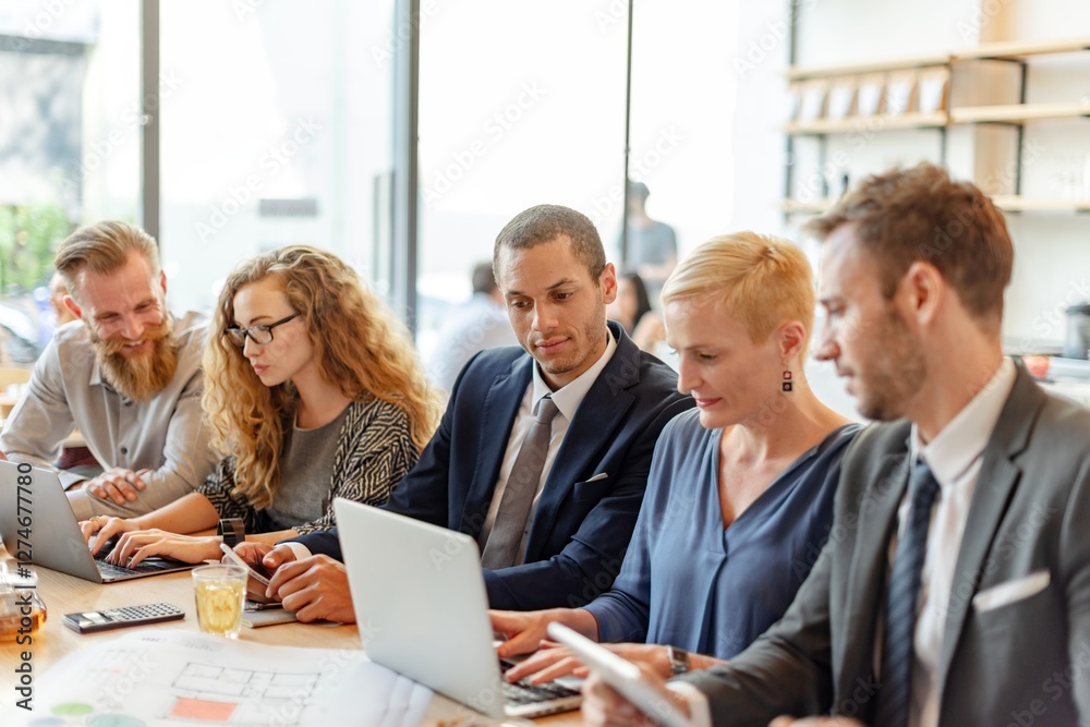Aufkleber diverse group of business people meeting together, using laptop and tablet in office. mixed genders 