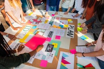 Diverse group collaborating on creative ideas. Teamwork with colorful notes and plans. Creative brainstorming with diverse team and vibrant ideas