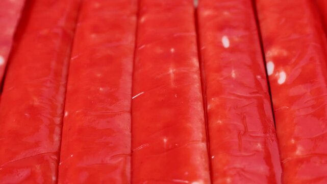 Red crab sticks or surimi circle rotation close up