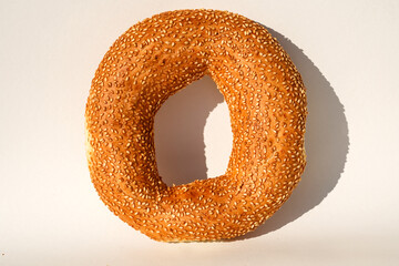 bagels with sesame seeds on white background