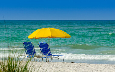beach chairs and umbrella on the beach