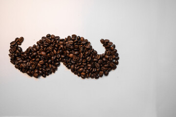 Coffee beans arranged in a mustache