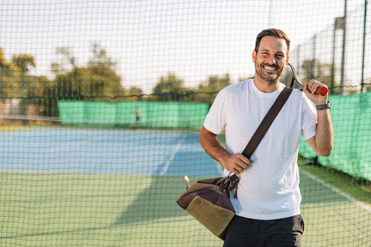 Young couple playing tennis outdoors enjoying a fun summer game