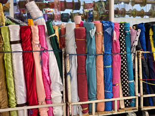 Colorful material fabric rolls - texture samples in the market