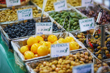 Olives and marinated garlic on a farmer market in Paris, France.
