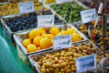 Olives and marinated garlic on a farmer market in Paris, France.