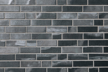 Dark Gray Brick Wall with a Slight Glossy Finish – Modern Architectural Pattern