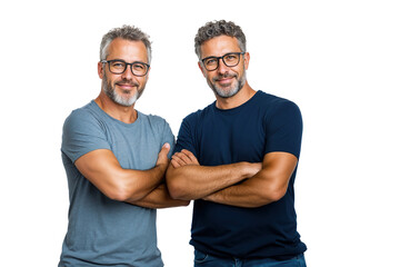 Two identical twin men stand side by side with arms crossed, smiling confidently. They wear casual clothing suitable for a professional business setting