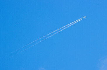 A Passenger Or Cargo Plane Flying High Above The Ground