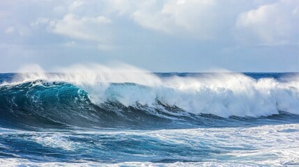 Fototapeta premium Waves surge violently onto a striking black sand beach, creating mist and showcasing the raw beauty of nature under an overcast sky