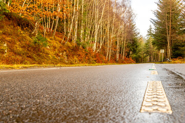 A Scottish Highland Road Taking Vehicles Through The Most Stunning Scenery