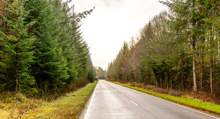 A Scottish Highland Road Taking Vehicles Through The Most Stunning Scenery