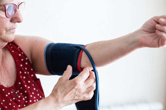 Elderly woman checking blood pressure