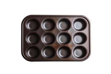 A beautifully arranged muffin tray ready for baking in a bright kitchen on a warm afternoon isolated on transparent background