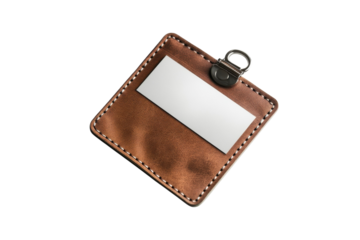 Brown leather badge holder resting on a smooth surface, ready for identification or access passes isolated on transparent background