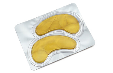 Pair of golden eye patches isolated on white background. Rubber made cosmetics pack 