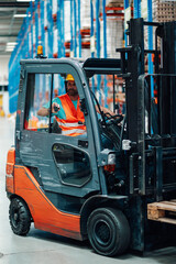 Warehouse worker driving forklift in logistics center