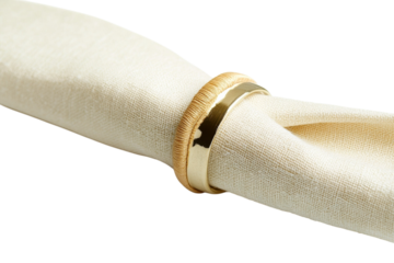 Elegant golden napkin ring adorning a beautifully folded cream-colored napkin isolated on transparent background