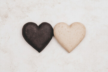 Obraz premium Two hearts, one black and one white