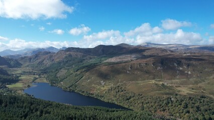 Llyn Geirionydd lies in a valley in North Wales where the northern edge of the Gwydyr Forest meets the lower slopes of the Carneddau mountains. The lake is almost a mile long.