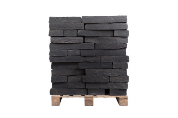 Stack of black bricks on a wooden pallet, isolated