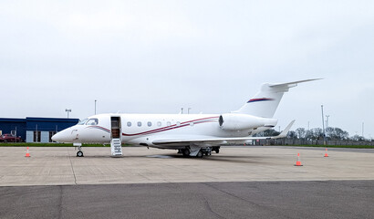A Private Jet's Parked Up At An Airport For It's Next Passenger(s)