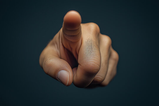 A close-up of a male hand pointing directly at the viewer, conveying a sense of urgency and emphasis.