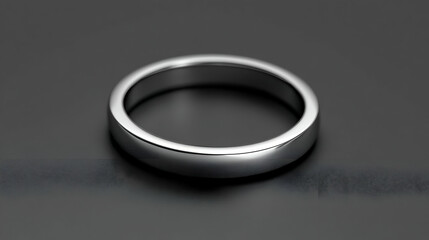 Fototapeta premium Polished Silver Ring on Dark Background