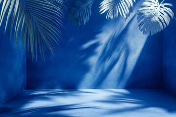 Blue studio backdrop, tropical leaves, sunlight, shadows, product display
