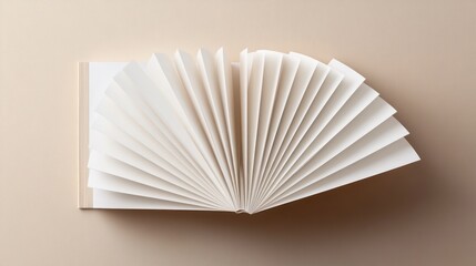 Elegant Open Book with Fanned Pages on Beige Background
