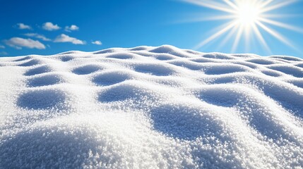 Obraz premium Sparkling Snowy Landscape Under Bright Blue Sky with Sunshine and Soft Clouds