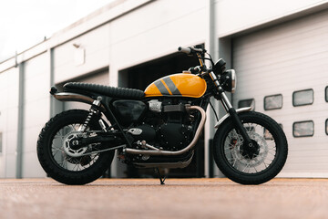 Retro motorcycle, yellow classic motorbike cafe racer scrambler style