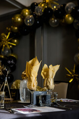 Elegant black and gold table decorations for wedding reception