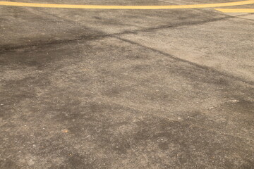 Fototapeta premium Airport floors are large areas of smooth grey concrete that stretch as far as the eye can see, with bright yellow stripes running across them to clearly divide the areas into sections. These yellow st