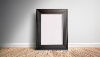 Minimalist Black Poster Frame against a Warm Wooden Floor and White Wall Backdrop, Embracing the Blank Canvas Awaiting Artistic Visions or Design Inspiration.