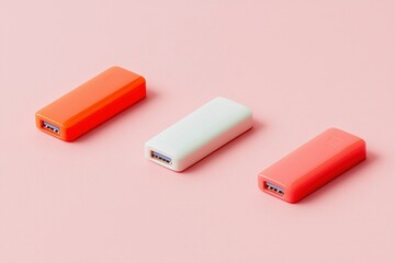 Colorful USB drives aligned on pink, for data storage, in the background