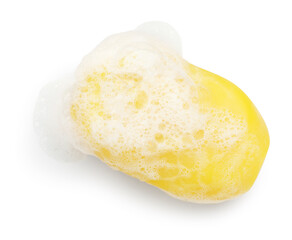 Yellow soap with foam on white background, above view