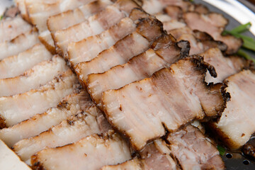 boiled pork in korean style on the plate, close up
