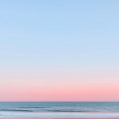 Obraz premium A serene beach scene at dusk with soft pastel colors in the sky and gentle ocean waves.