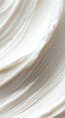 Obraz premium A close-up view of smooth, creamy texture resembling frosting or whipped cream.
