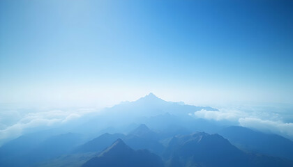 Serene mountain range landscape, aerial view showcasing majestic peaks and a clear blue sky, perfect for travel, nature, and tranquility themes.